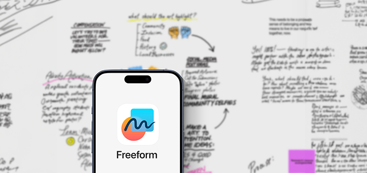 A Freeform board with an iPhone in the foreground