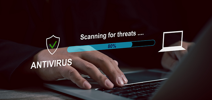 A laptop screen showing a progress bar for an antivirus scan