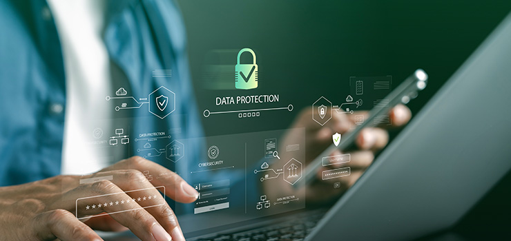 A person using a laptop which shows a digital security interface